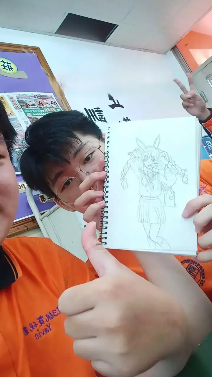Classmates sharing a drawing at school